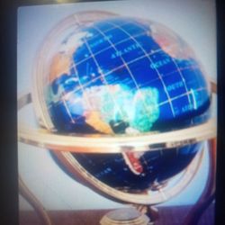 Gemstone inlaid world globe with brass tone stand and compass