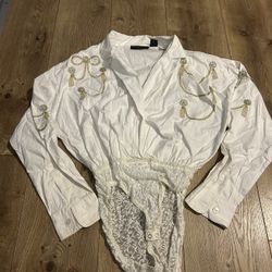 vintage 1980s or 1990s white button-down bodysuit romper featuring gold embroidery. Media 
