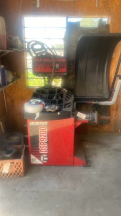 Tire machine, and wheel balancer