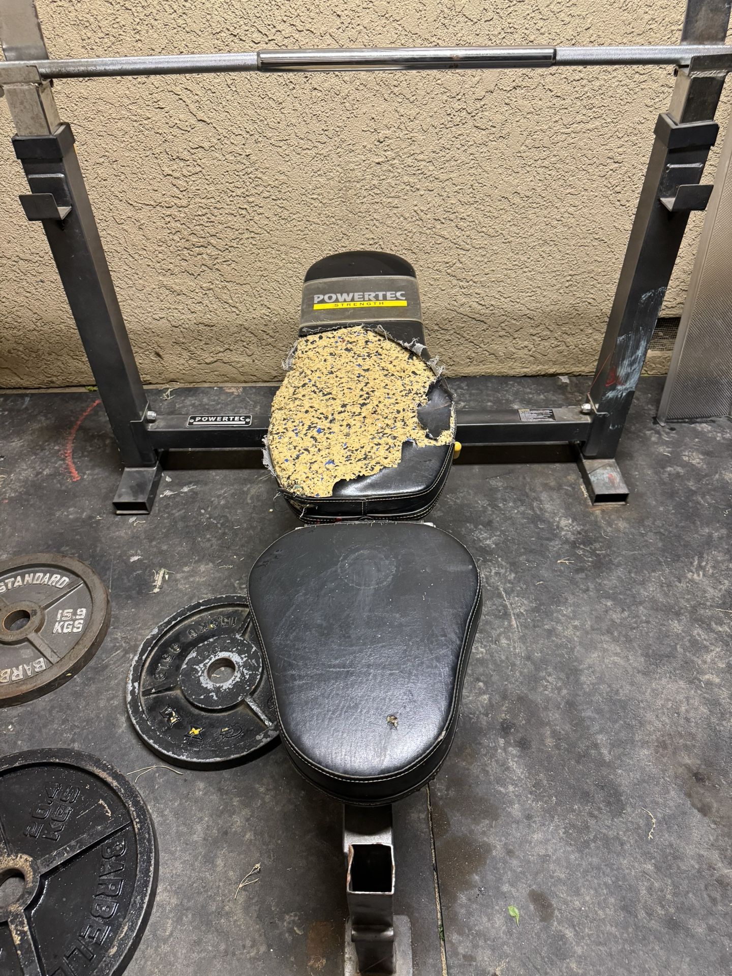 Adjustable Bench Press With Barbell And Plates