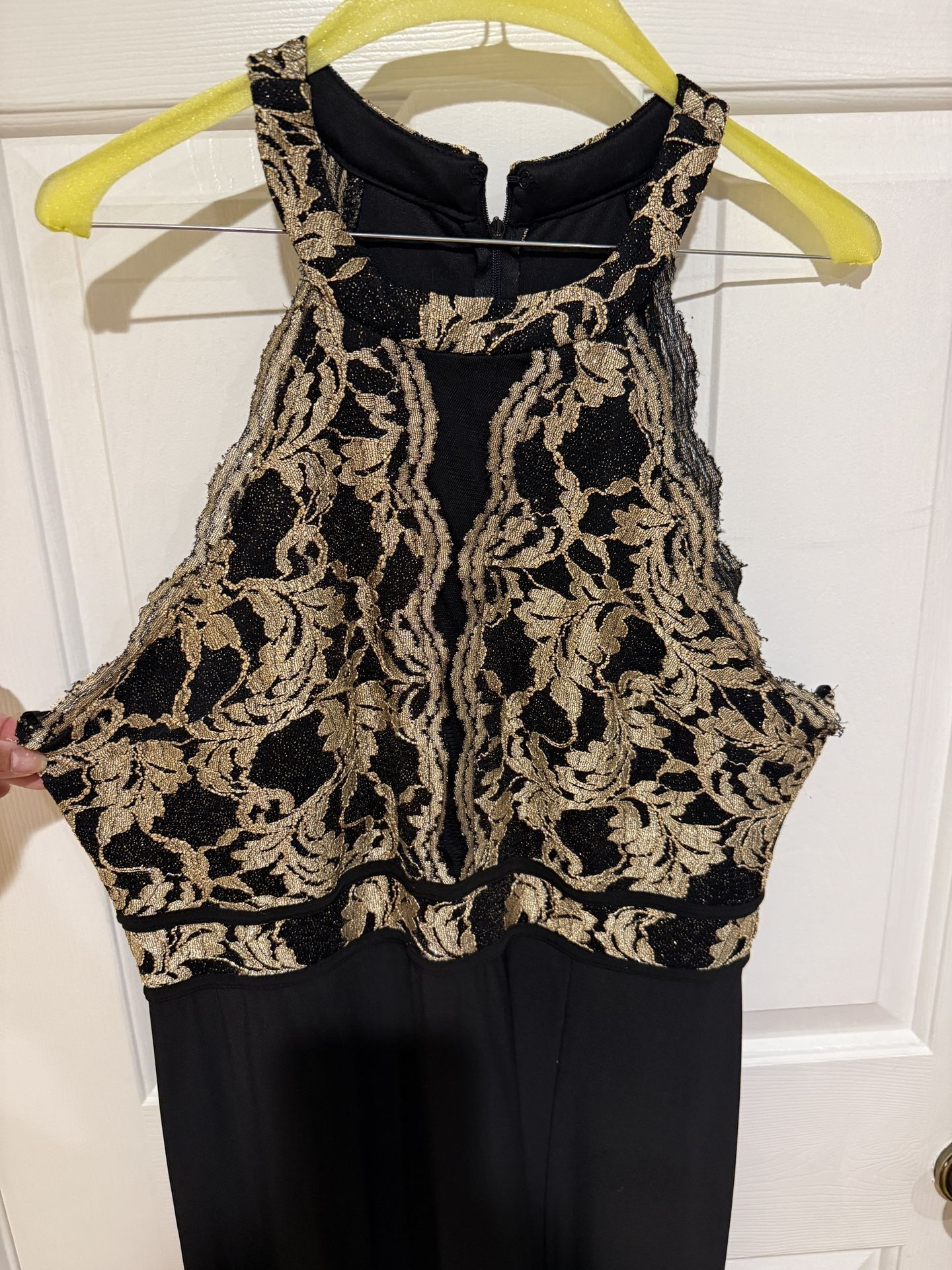 The Morgan & Co black evening gown. Gold embellishments on bodice.