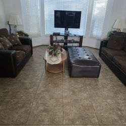 Leather/alcantra, suede living room set with center table, Ottoman, two side tables and lamps.