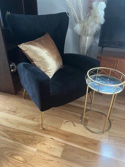 Black chair with yellow pillow and golden table all for $60