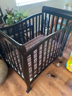 Mini crib and changing table set. Matress and pads included.