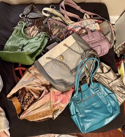 Many different sizes purses handbags clutch Crossbody different colors.