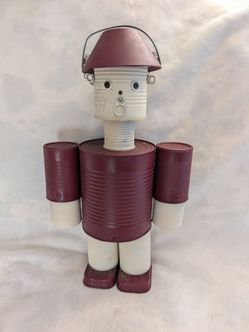 Handmade red and white folk art tin man.