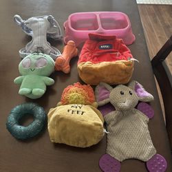 Dog toys, water and food bowl, and small harness