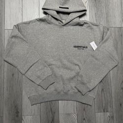 Brand new Fear of God Essentials hoodie in Dark Oatmeal.