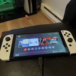 OLED Nintendo Switch With 4 Games Included