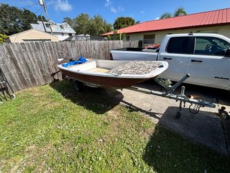 12’ boat with trolling motor and trailer,  has a 3hp motor included