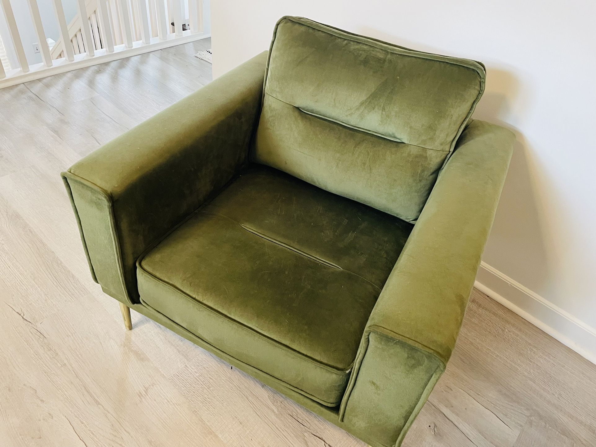 mid-century modern green velvet armchair.