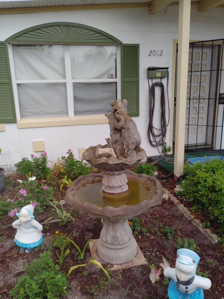 Bear Eating Out Of The Tree Fountain