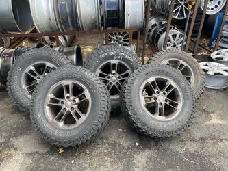 Set of original OEM JEEP 17in 5x127 used rims with used tires LT 255/75R17 500$ for 5 rims with 5 tires plus tax .  Mount available but not included. 