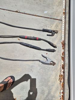 Welding electrode holder and ground clamp assembly,