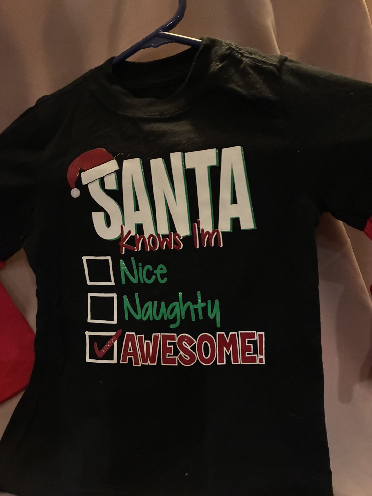 Black t-shirt with festive Santa design. Holiday time size 4