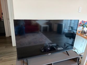 TCL 50 inch tv with grey tv stand from Ikea