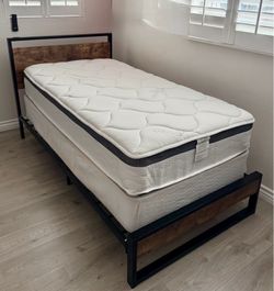 Single bed, mattress, and box spring.
