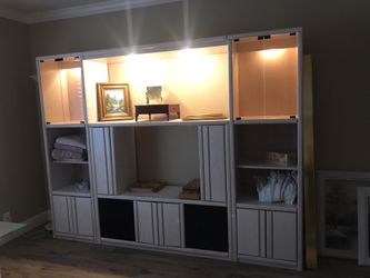 Entertainment center with pull out shelves
