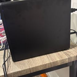 It’s a PC and comes with a keyboard and mouse