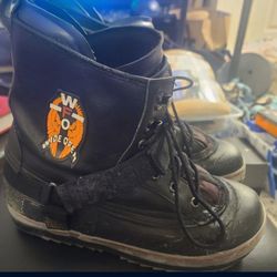 Black ENI snowboard boots with strap and lace-up design. Size 11