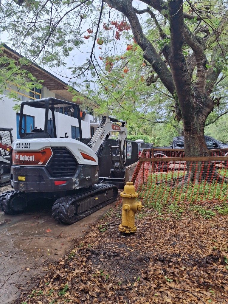 Bobcat And Excavator