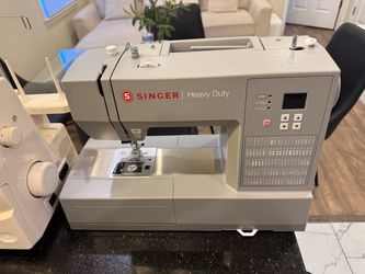 Singer Sewing Machine - $150
