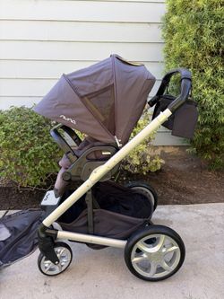 Nuna Mixx Next Stroller With Accessories And Nike Shoes