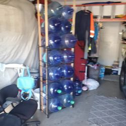 10 5 Gallon Bottle Holder $70.00 Bucks /14 Empty 5 Galllon Bottles $5.00 Bucks Each