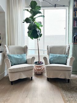 $450 — Set of 2 IKEA STRANDMON Wingback Chairs + Custom Oatmeal Slipcovers Like New