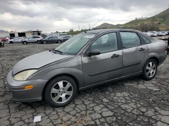 2000 Ford Focus Se auction block all parts to fix car included car runs