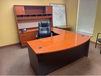 Office desk with shelves and file cabinets.