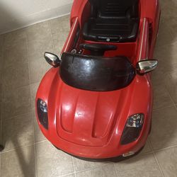 kids' electric ride on car with a parental remote control