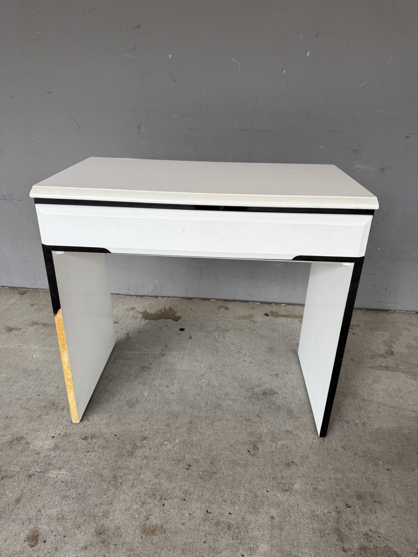 White desk with black trim. Lane Company