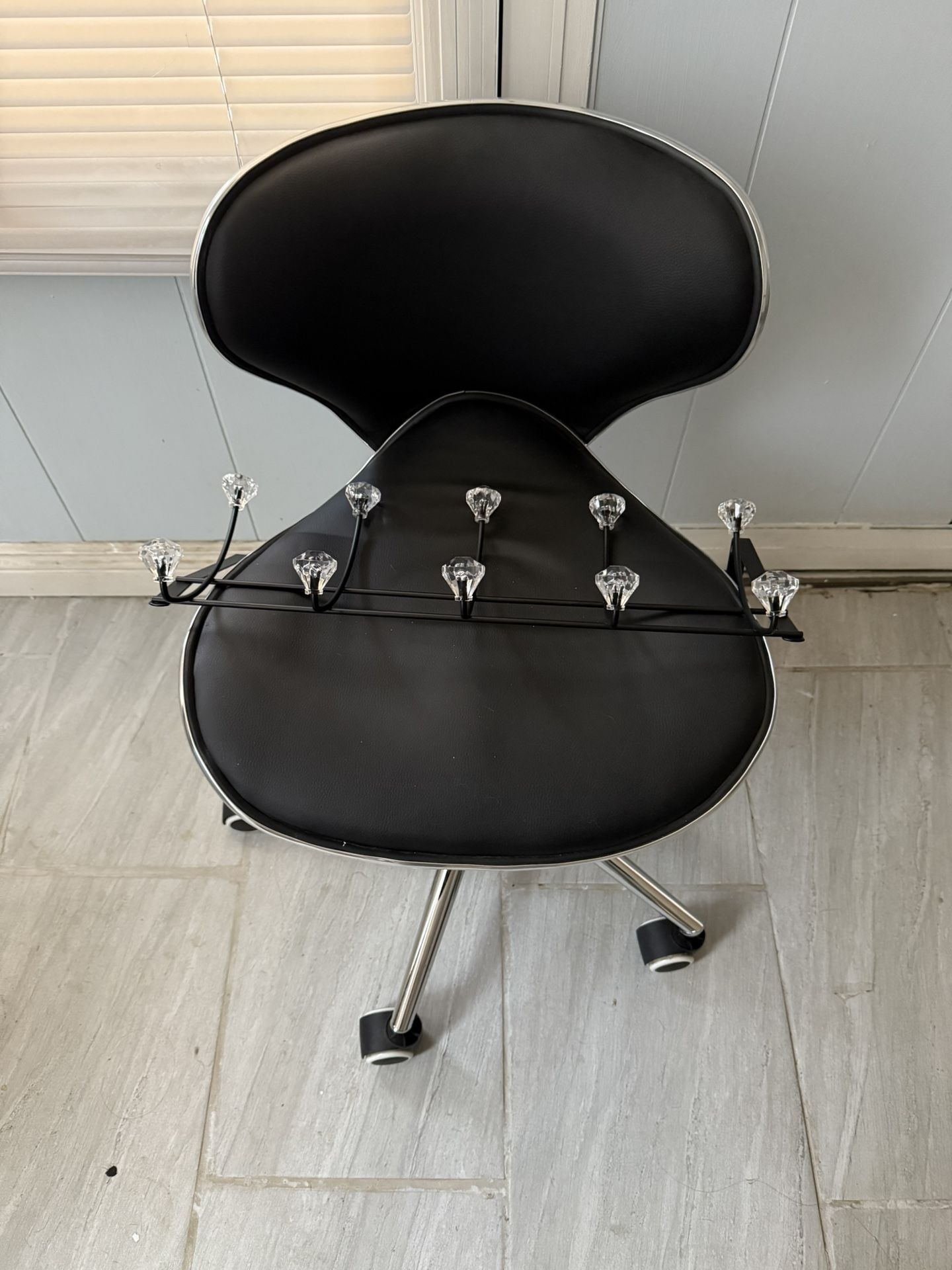 black vanity chair and hanger