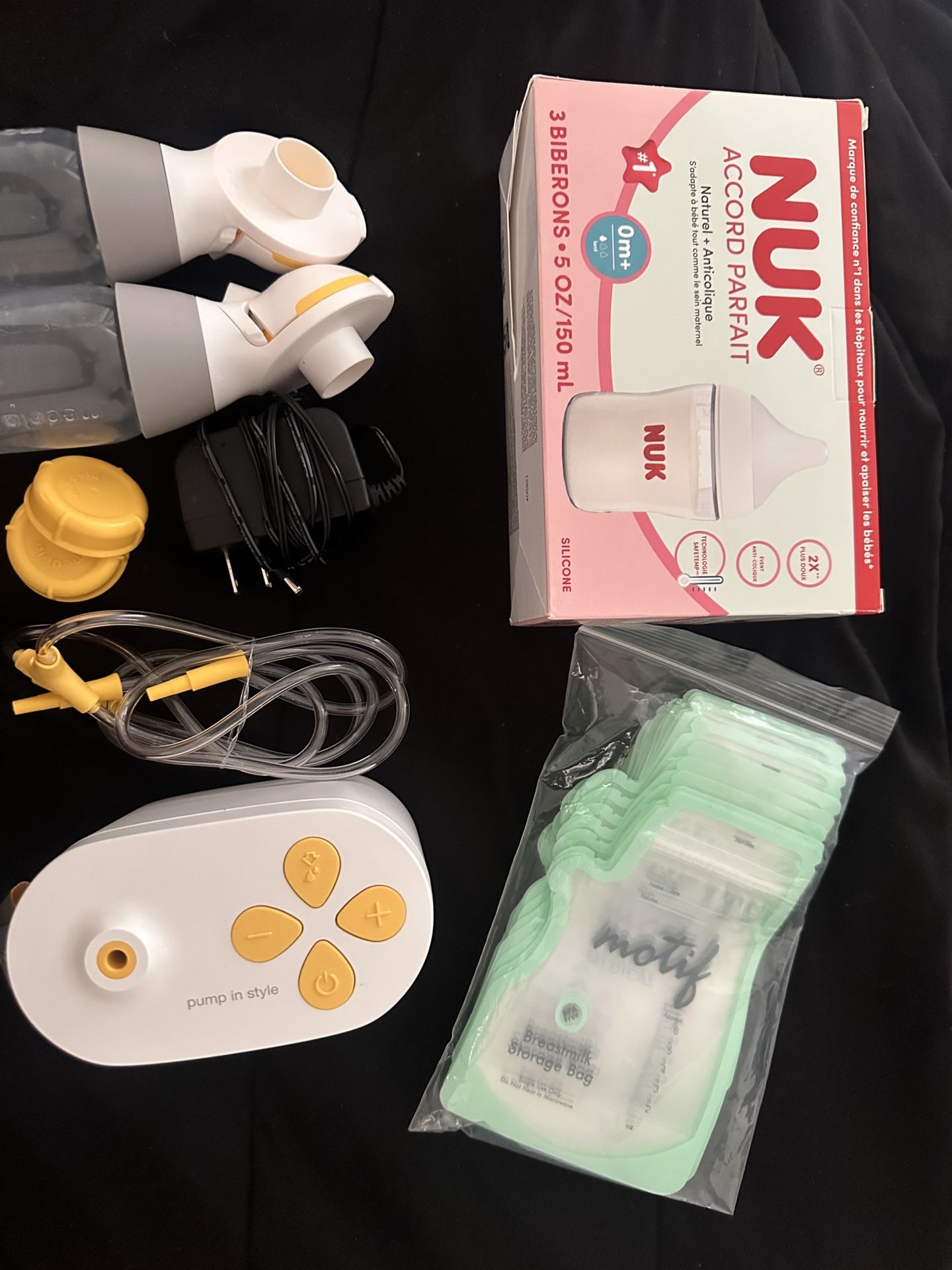 medela breast pump and bottles + storage bags
