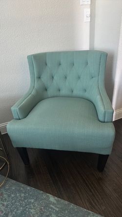 2 teal tufted accent chairs