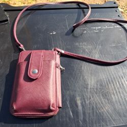 burgundy crossbody bag is likely the Mundi Jacqui Cell Phone Wallet