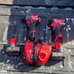 Milwaukee Drills, Batteries, And Charger 