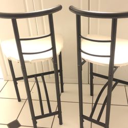 Newly Upholstered wrought Iron Bar stools with white new leather like seats new