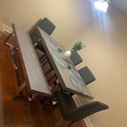 Living room table with chairs and bench