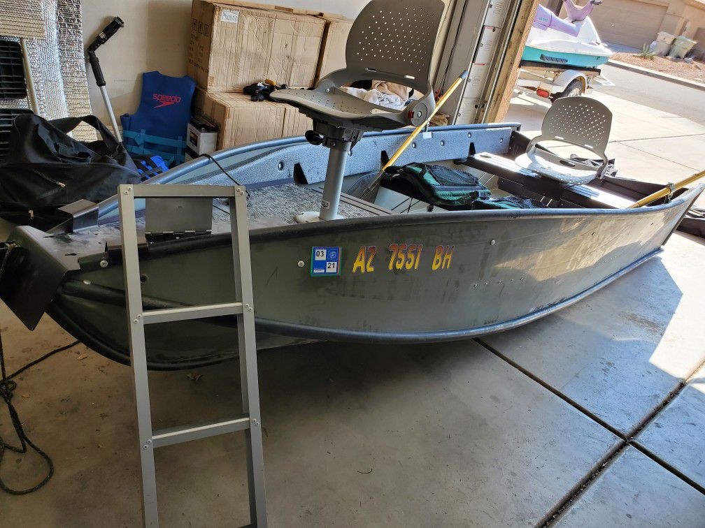 2004 Porta Bote 12ft foldable fishing boat with Nissan 4-stroke 6hp outboard motor