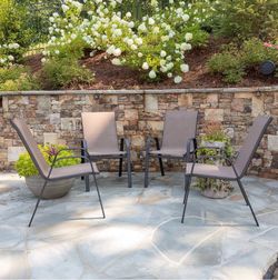 Pack of 4 brown stackable outdoor chairs with Flex Comfort material and metal frame