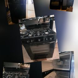 Refrigerator With Ice Maker  And Black Gas Stove