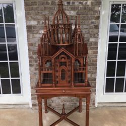 large Victorian-style cathedral bird cage / bird house display piece. It’s more of a decorative antique-style art piece than a regular functional cage