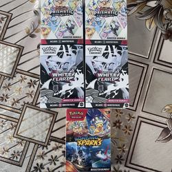 Surging Sparks, White Flair, And Prismatic Evolutions Booster Bundles