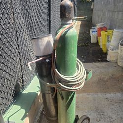 Welding and cutting torch with 2 tanks.