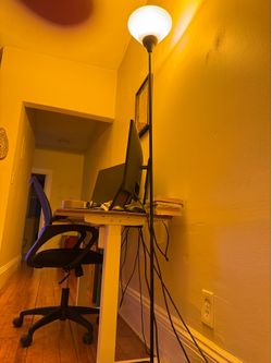 IKEA tall lamp with three adjustable lighting settings