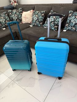 2 maletas nuevas azul 27” ancho x 25” alta y verde 22” alto x 14” ando pido $50 por las 2