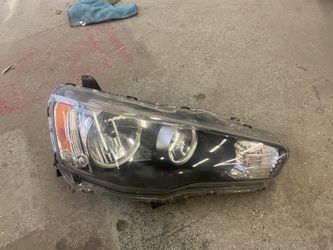 Passenger side Evo x oem headlight