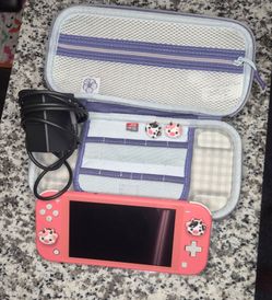 Nintendo Switch Lite (Used-Like New)(Coral) with case, 128 GB microSD Card, Thumb Grips, and Pokémon Hard Protective Carrying Case